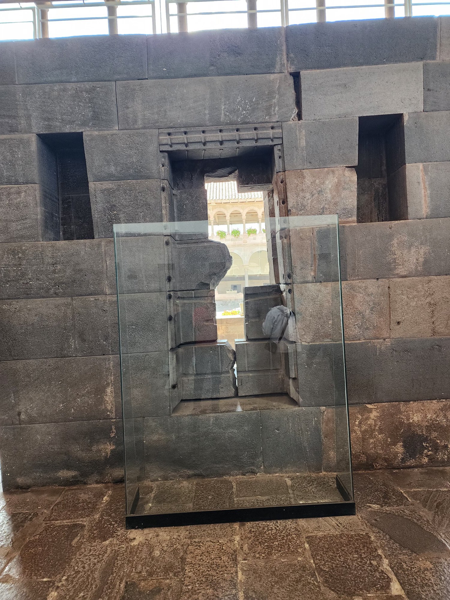 Inca stonework at Coricancha preserved behind glass